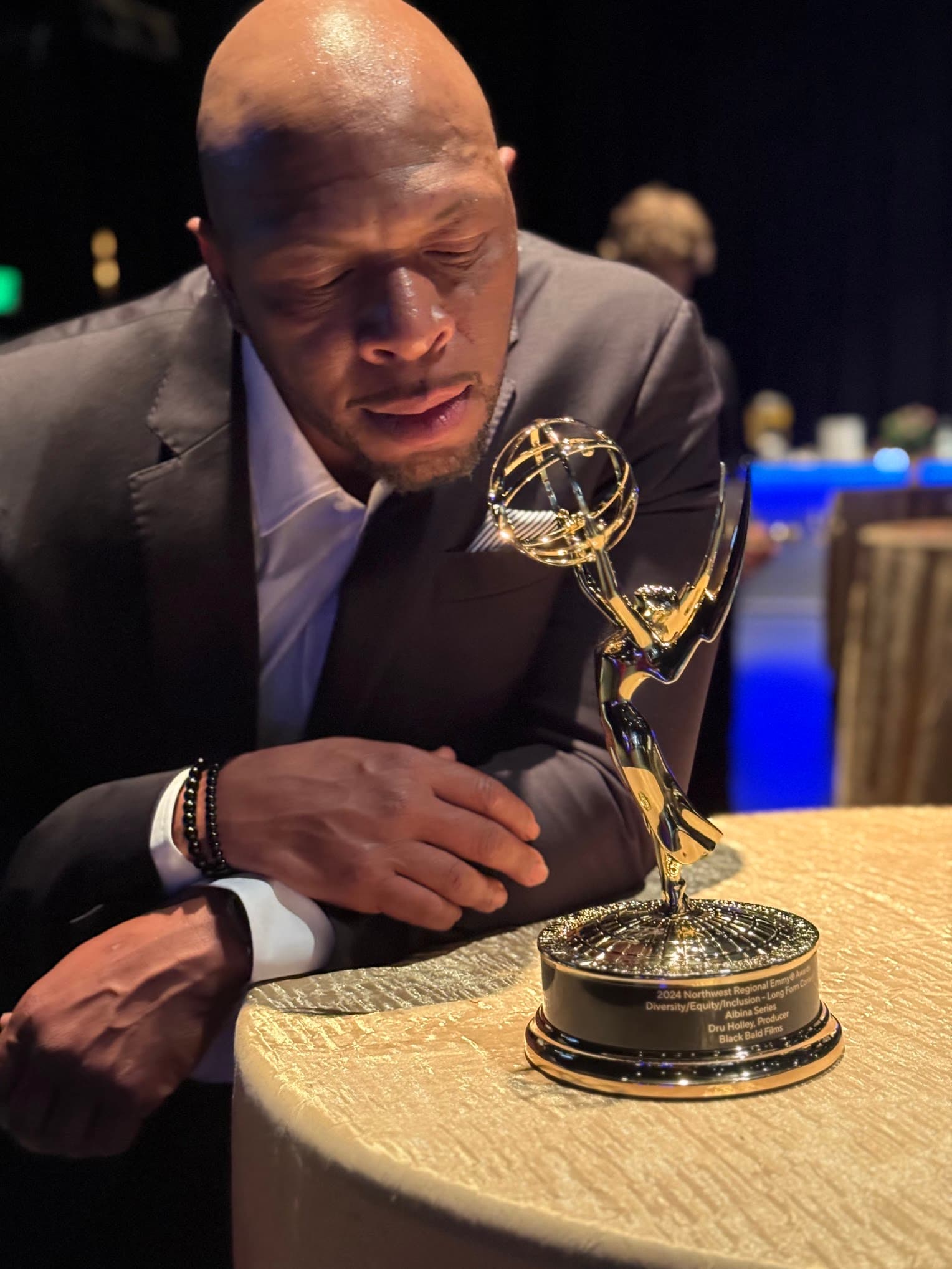 Dru Holley, MenuMingle founder, holding his Emmy award